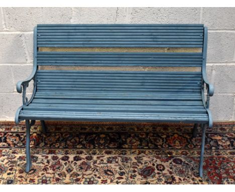 A blue painted garden bench with cast iron end, height 76cm.
