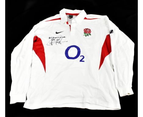JONNY WILKINSON; a replica 2003 England rugby shirt, signed to front, size XL.&nbsp;Additional InformationCreasing and light 