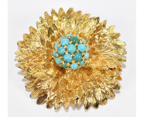 An 18ct yellow gold textured floral brooch centred with a dome of turquoise, diameter 40mm,&nbsp;approximately 19.5g.&nbsp;&n