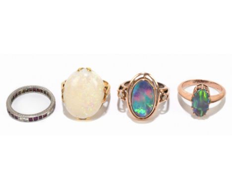 A 14ct yellow gold opal set dress ring, size K 1/2, opal approx 1.7cm long, together with two yellow metal opal dress rings, 