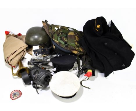 Various pieces of military uniform, including berets, hats, overalls, gas masks, etc.&nbsp;