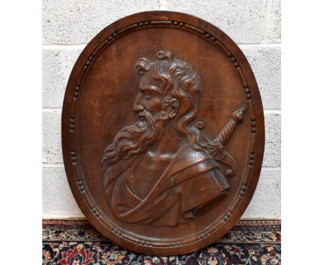 A large 19th century carved oak portrait panel, depicting a bearded gentleman with a sword, unsigned, 82cm x 67cm.&nbsp;Addit
