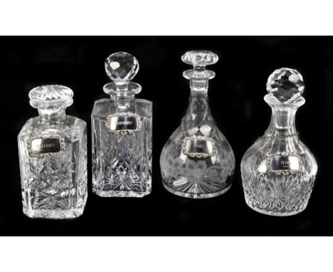 Four cut glass decanters, with four Elizabeth II hallmarked silver decanter labels inscribed 'Gin', 'Sherry', 'Port', 'Whisky