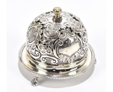 A late Victorian pierced hallmarked silver silver table bell, with scroll and foliate detailing, Birmingham 1899, diameter 9.