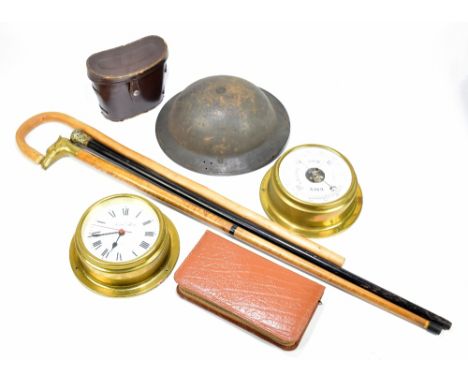 A WWII ARP type helmet, with a silver mounted ebonised walking cane, two other walking sticks, a modern battery operated bulk