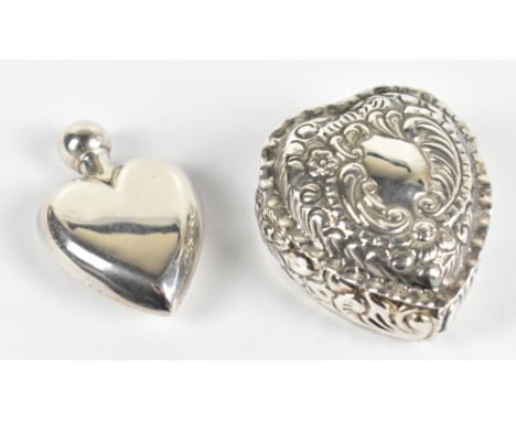 A modern hallmarked silver heart shaped scent bottle, London 1995, with a heart shaped pill box, Sheffield 1999, combined wei