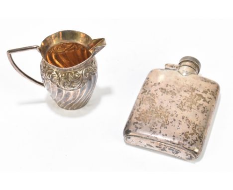 A hallmarked silver silver hip flask, and a late Victorian hallmarked silver cream jug with cast and gadrooned body, Birmingh