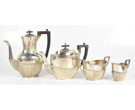 WALKER &amp; HALL; a late Victorian silver three piece tea service with ebonised finial and handle, Sheffield 1899, with a si