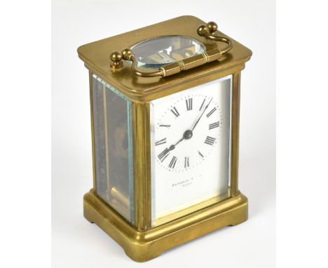 FATTORINI &amp; SONS PARIS; a brass cased carriage clock, the enamel dial set with Roman numerals, height including swing han