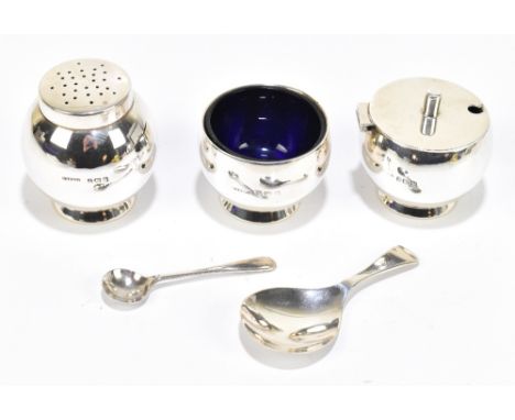 A George V hallmarked silver three piece cruet, Birmingham 1935, 4.1ozt / 129g, with two associated silver spoons and two blu