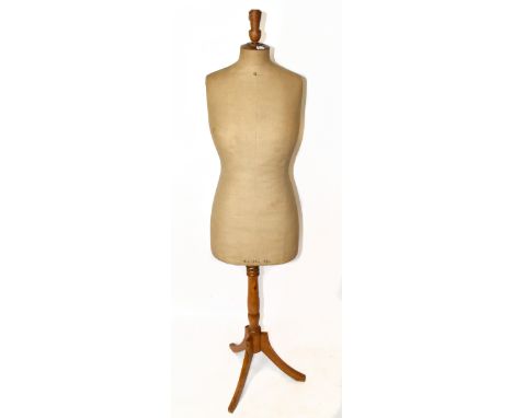 An early 20th century c.1900 French mannequin/tailor's dummy, with beige cloth to body and solid wooden tripod base, height 6