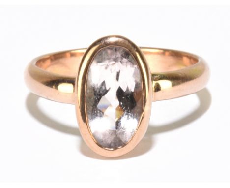 A 9ct rose gold and morganite ring with oval stone with rubover setting, the morganite 10mm, size P, approx 4.7g.Additional I