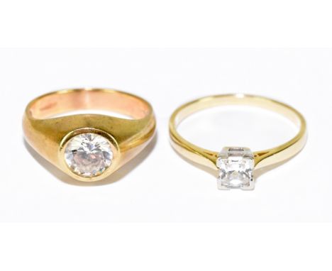 A 9ct yellow gold gypsy set single stone ring, size S, and a 14ct yellow gold single stone princess cut claw set dress ring, 