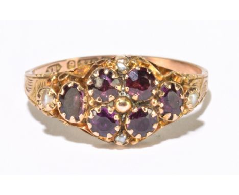 An early 20th century 9ct yellow gold amethyst and seed pearl dress ring with sealed back, ring R 1/2, approx. 1.85g.Addition