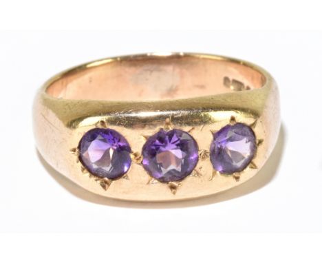 A 9ct yellow gold and three stone amethyst ring,&nbsp; ring size T, approx. 7.2g.&nbsp;Additional InformationSurface scratche