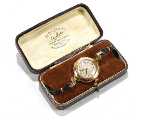 ROLEX; a lady's 9ct gold cased Trench style watch, the silvered dial set with Arabic numerals, with fifteen jewel movement, d