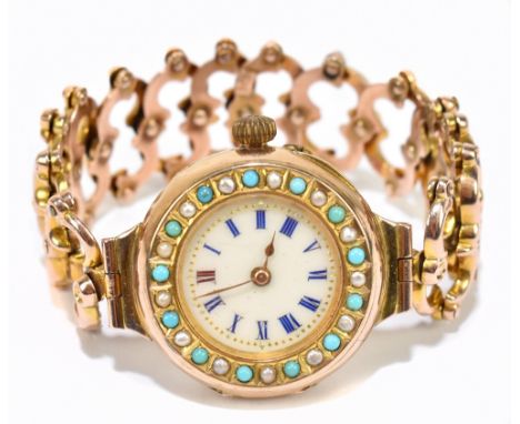 An unusual 9ct yellow gold wristwatch with turquoise and seed pearls to the bezel, the white enamel dial set with Roman numer