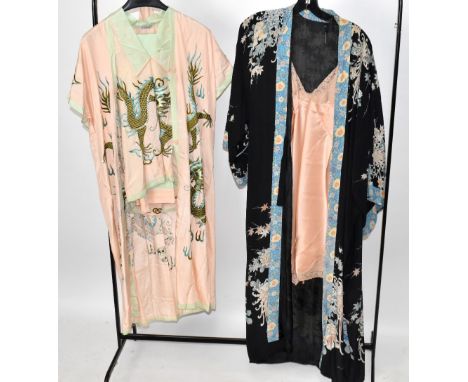 A mid-20th century hand embroidered pink silk pyjama set and matching dressing down depicting a Chinese dragon, trimmed with 
