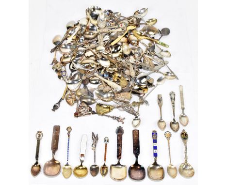 A collection of fourteen Continental 830 standard silver and white spoons, some with enamel detailing, and a large collection