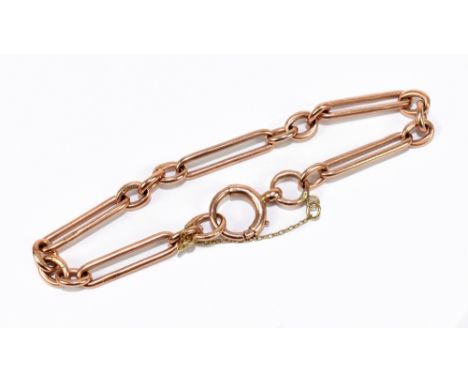 A 9ct rose gold trombone link bracelet with bolt ring clasp and safety chain, length 18cm, approx. 12.74g.&nbsp;