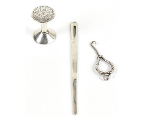 A Continental silver folding button hook, with a 19th century white metal cotton reel and a Dutch silver bodkin, the longest 