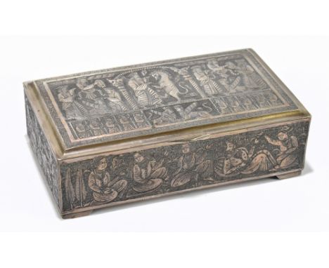A Persian white metal cigarette box of rectangular form with cast decoration of mythical Gods and creatures, width 16cm, appr