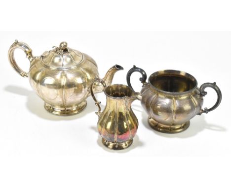 MARTIN, HALL & CO; a Victorian silver three piece tea service, the teapot with fruit and leaf finial, and handle with two ivo