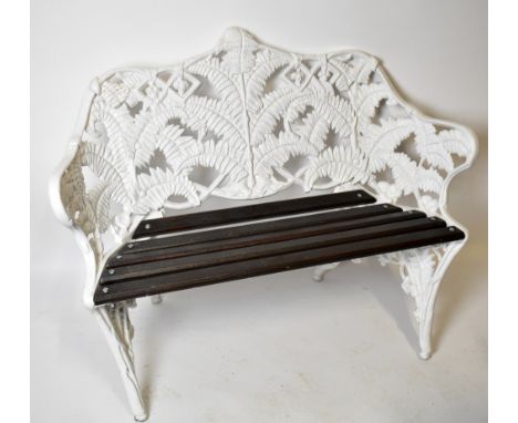 A reproduction Coalbrookdale style white painted fern design garden bench, width 112cm.
