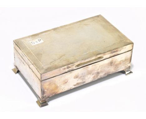AT &amp; SN; an Elizabeth II hallmarked silver cigarette box with rectangular form, the hinged cover with engine turned decor