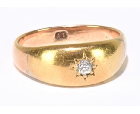 A yellow metal and diamond single stone ring, stamped 18, size O, approx. 5.4g.Additional InformationGeneral surface wear thr