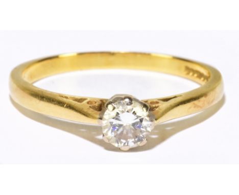 An 18ct yellow gold and diamond solitaire ring, the eight claw set round brilliant cut stone weighing approx. 0.25cts, ring s