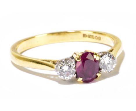 An 18ct yellow gold ruby and diamond three stone ring, size M,&nbsp;approximately 2.8g.&nbsp;Additional InformationThe tips o