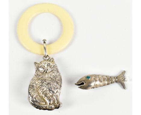 A hallmarked silver rattle modelled as a cat, Birmingham 1964, length 10.25cm, with a silver articulated fish (2)Additional I
