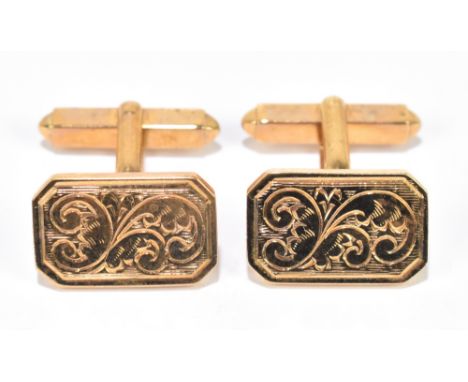 A pair of 9ct yellow gold cufflinks with engraved scrolls to the rectangular platforms,&nbsp;approximately 9.2g.&nbsp;Additio