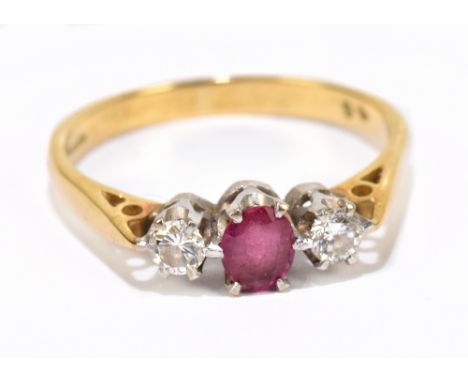 A 18ct gold ruby and diamond three stone ring, ring size Q, approx weight 3.4g.&nbsp;