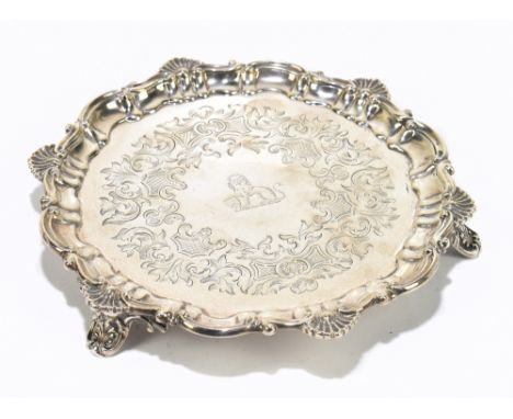 A Victorian hallmarked silver waiter, with scroll and shell border, London, 1857, 8.0ozt / 251g, diameter 17cm.Additional Inf