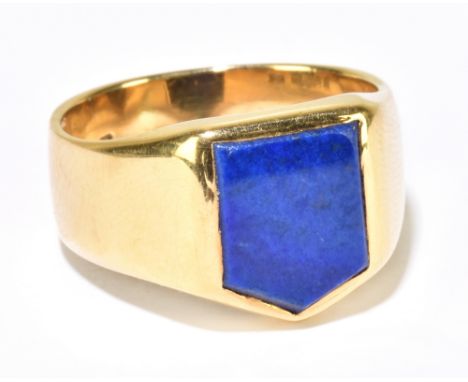 An 18ct yellow gold signet ring, with shield shaped panel of lapis lazuli, ring size Q, approx. 11.3g.Additional InformationM