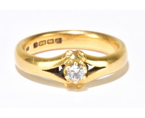 A 22ct yellow gold and diamond solitaire ring, the six claw set round brilliant cut stone weighing approx. 0.15cts, in pierce