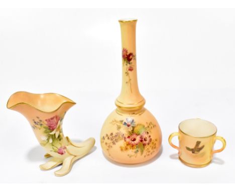 ROYAL WORCESTER; a blush ivory cornucopia vase, shape number 2579, height 9.5cm, together with a Royal Worcester blush ivory 