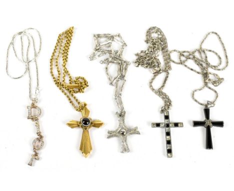 DIOR; a silver tone necklace with drop letters spelling Dior, a gold tone vintage chain with cross with large black cabochon,