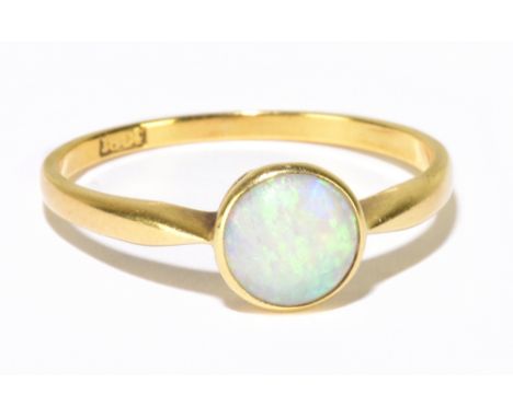 An 18ct yellow gold and collet set opal ring, size P 1/2, approx. 2g.Additional InformationThe opal is approx. 6.3mm diameter