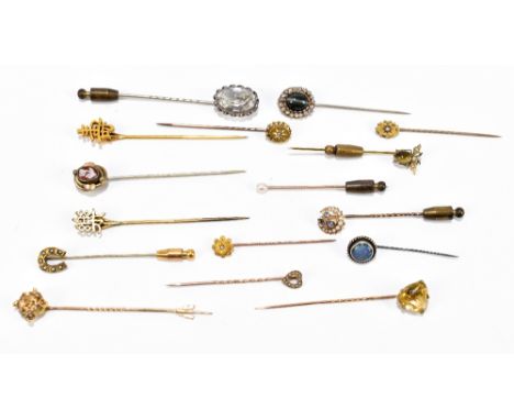 Sixteen yellow and white metal stick pins, including example with opal, citrine and seed pearls.&nbsp;