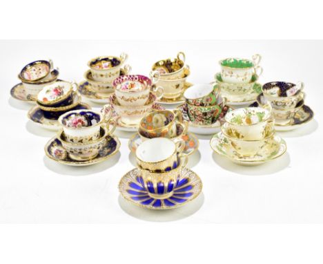 A collection of early 19th century porcelain trios including Imari decorated examples, Coalport style examples with hand pain