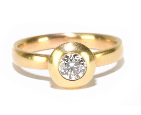 An 18ct yellow gold solitaire diamond ring, the brilliant cut stone weighing approx 0.40ct in rubover setting on plain D-shap