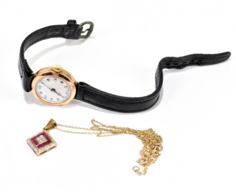 A lady's vintage 9ct yellow gold wristwatch, and a 9ct yellow gold fine link chain suspending a ruby and diamond small lozeng