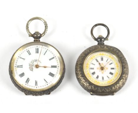 A 935 grade silver key wind lady's fob watch, the enamel dial with gilt floral detail surrounding the circular chapter ring b