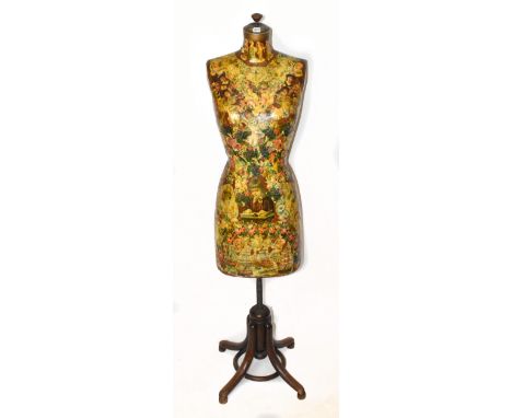 An early 20th century French heavy mannequin/tailor's dummy, with a solid wooden base and covered in decoupage from the era.A