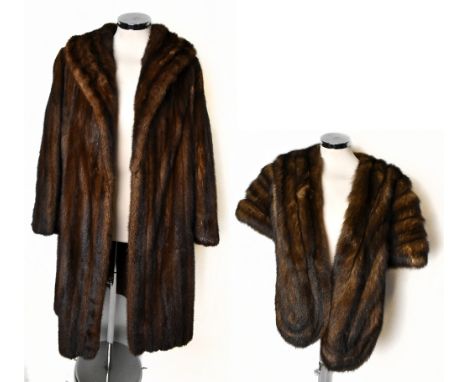 A full length vintage dark chocolate brown mink coat with large collar, cuffed sleeves, slit front pockets and lined with a b