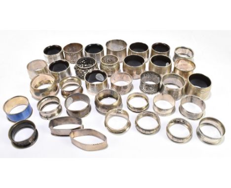 A collection of nineteen silver napkin rings, various dates and makers, weight 8ozt./249g, with thirteen other napkin rings i