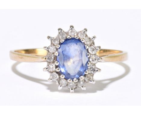 A 9ct yellow gold floral set ring, size R, approx 1.9g.Additional InformationSurface abrasions to the pale blue stone, light 